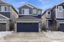 Craftsman inspired home featuring stone siding, roof with shingles, concrete driveway, and a garage - 16627 31 Avenue, Edmonton, AB  - Outdoor With Facade 