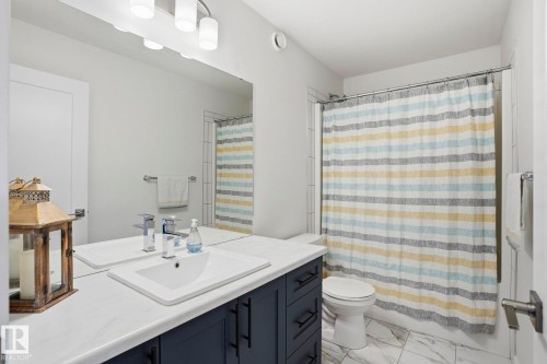 Bathroom featuring vanity and light marble finish floors - 16627 31 Avenue, Edmonton, AB - Indoor Photo Showing Bathroom