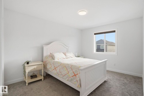 Bedroom with carpet flooring and baseboards - 16627 31 Avenue, Edmonton, AB - Indoor Photo Showing Bedroom