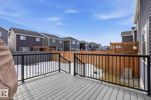 Wooden deck featuring a residential view - 16627 31 Avenue, Edmonton, AB - Outdoor With Exterior