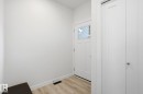Doorway to outside with baseboards and wood finished floors - 16627 31 Avenue, Edmonton, AB  - Indoor Photo Showing Other Room 