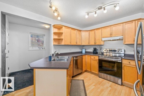 69 Erie Street, Devon, AB - Indoor Photo Showing Kitchen With Double Sink