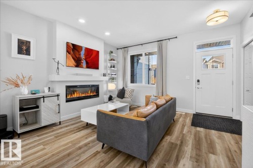 535 Paterson Way, Edmonton, AB - Indoor Photo Showing Living Room With Fireplace