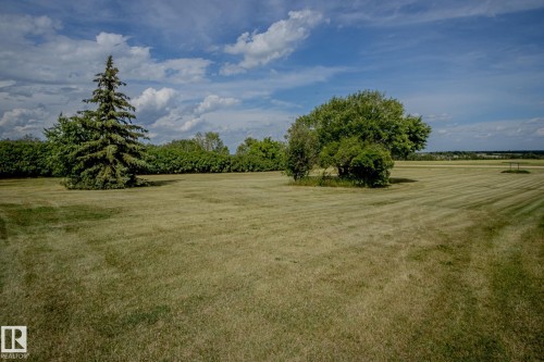 View of green lawn featuring a view of countryside - 56430 Range Rd 113, Rural St. Paul County, AB - Outdoor With View