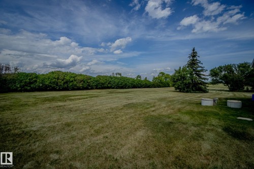 View of green lawn featuring a rural view - 56430 Range Rd 113, Rural St. Paul County, AB - Outdoor With View