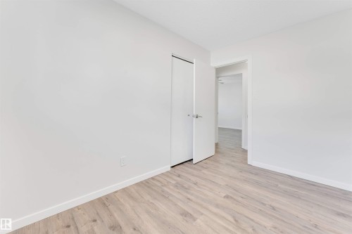 Unfurnished bedroom featuring light wood-style floors and a closet - 14511 21 St., Edmonton, AB - Indoor Photo Showing Other Room