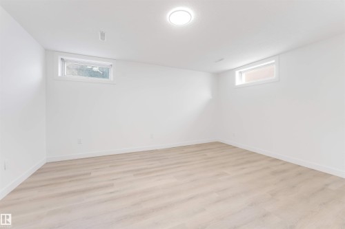 Basement with light wood-type flooring - 14511 21 St., Edmonton, AB - Indoor Photo Showing Other Room