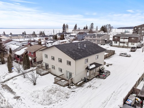 Snowy aerial view with a residential view - 914 9 Street, Cold Lake, AB - Outdoor With Body Of Water