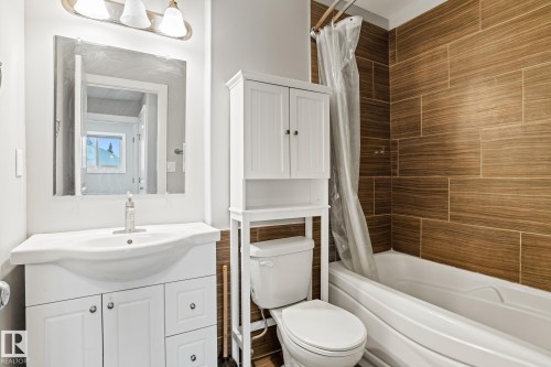 Full bath featuring vanity and shower / bathtub combination with curtain - 914 9 Street, Cold Lake, AB - Indoor Photo Showing Bathroom