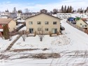 Snow covered rear of property featuring a wooden deck and a residential view - 914 9 Street, Cold Lake, AB  - Outdoor 