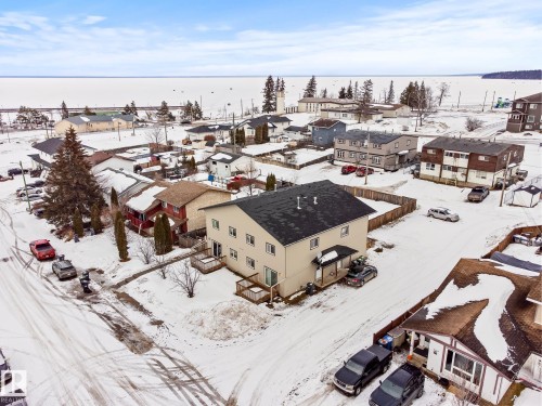 Snowy aerial view with a residential view - 914 9 Street, Cold Lake, AB - Outdoor With Body Of Water With View