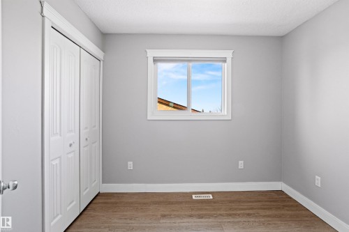 Unfurnished bedroom with light wood finished floors, a closet, and a textured ceiling - 914 9 Street, Cold Lake, AB - Indoor Photo Showing Other Room