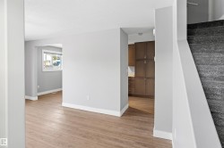 Staircase featuring wood finished floors - 