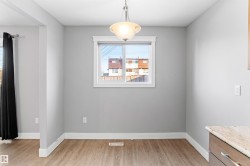 Unfurnished dining area featuring light wood finished floors and baseboards - 