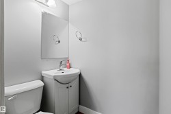 Half bath with vanity and toilet - 