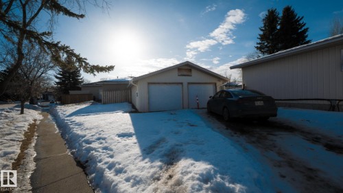 View of snowy exterior with a garage - 11 Austin Crescent, St. Albert, AB - Outdoor