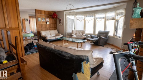 Living room featuring hardwood / wood-style flooring and a textured ceiling - 11 Austin Crescent, St. Albert, AB - Indoor Photo Showing Other Room