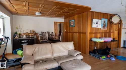 Living area with wooden walls and wood finished floors - 11 Austin Crescent, St. Albert, AB - Indoor Photo Showing Living Room