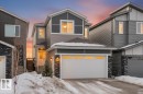 View of front of house featuring stone siding and driveway - 342 Meadowview Drive, Fort Saskatchewan, AB  - Outdoor With Facade 