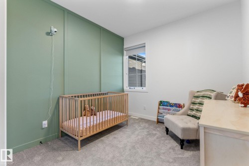 Bedroom featuring a nursery area and light colored carpet - 342 Meadowview Drive, Fort Saskatchewan, AB - Indoor Photo Showing Bedroom