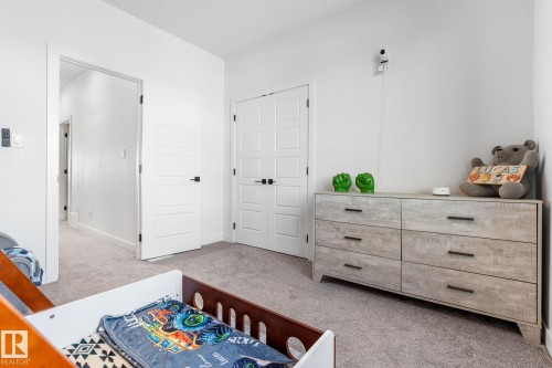 Bedroom with light colored carpet and a closet - 342 Meadowview Drive, Fort Saskatchewan, AB - Indoor Photo Showing Bedroom