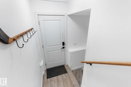 Doorway with wood finished floors - 342 Meadowview Drive, Fort Saskatchewan, AB - Indoor Photo Showing Other Room