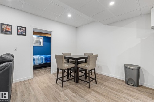 Dining area featuring a paneled ceiling, light wood-type flooring, and recessed lighting - 342 Meadowview Drive, Fort Saskatchewan, AB - Indoor