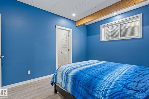 Bedroom with wood finished floors, beamed ceiling, and recessed lighting - 342 Meadowview Drive, Fort Saskatchewan, AB - Indoor Photo Showing Bedroom