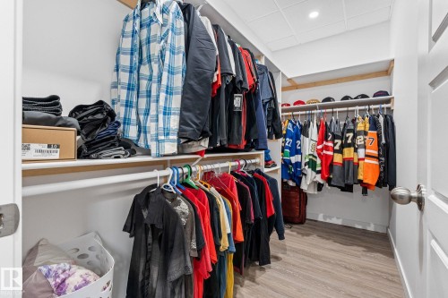 Walk in closet with a paneled ceiling and light wood-type flooring - 342 Meadowview Drive, Fort Saskatchewan, AB - Indoor With Storage