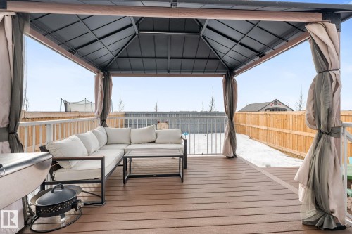 Deck featuring a gazebo, outdoor furniture, and a fenced backyard - 342 Meadowview Drive, Fort Saskatchewan, AB - Outdoor With Deck Patio Veranda With Exterior