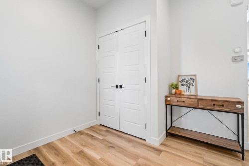 Entryway with light wood-style floors and baseboards - 342 Meadowview Drive, Fort Saskatchewan, AB - Indoor Photo Showing Other Room