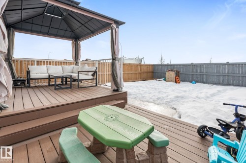 Wooden deck featuring a fenced backyard and an outdoor lounge area - 342 Meadowview Drive, Fort Saskatchewan, AB - Outdoor With Deck Patio Veranda With Exterior