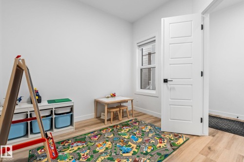 Rec room featuring light wood-style floors - 342 Meadowview Drive, Fort Saskatchewan, AB - Indoor Photo Showing Other Room