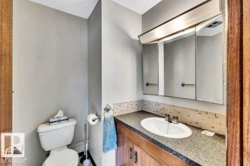 Bathroom with decorative backsplash and vanity - 4314 52 Street, Wetaskiwin, AB - Indoor Photo Showing Bathroom