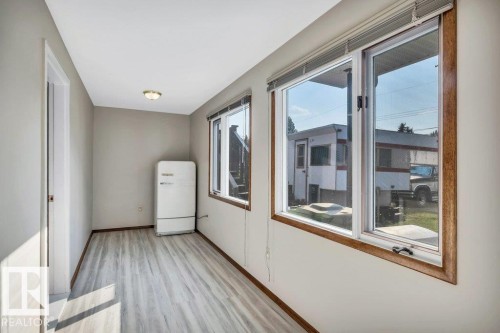 Unfurnished room featuring light wood-style flooring and baseboards - 4314 52 Street, Wetaskiwin, AB - Indoor Photo Showing Other Room