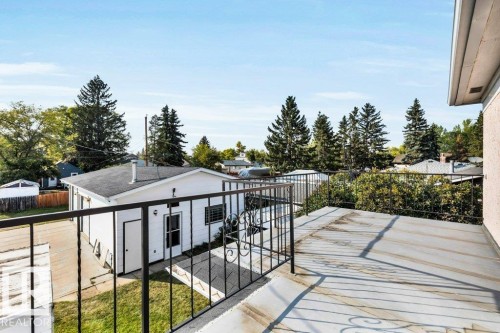 Wooden terrace featuring an outbuilding - 4314 52 Street, Wetaskiwin, AB - Outdoor With Exterior