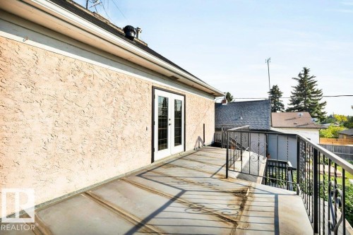 Wooden terrace with french doors - 4314 52 Street, Wetaskiwin, AB - Outdoor With Deck Patio Veranda With Exterior