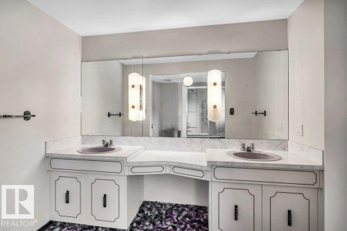 Full bath featuring double vanity and a shower stall - 4314 52 Street, Wetaskiwin, AB - Indoor Photo Showing Bathroom
