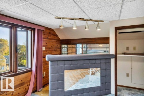 Detailed view of wood walls and a paneled ceiling - 4314 52 Street, Wetaskiwin, AB - Indoor Photo Showing Other Room