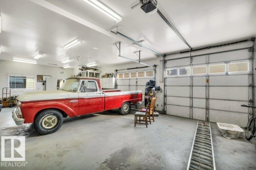 Garage with a garage door opener - 4314 52 Street, Wetaskiwin, AB - Indoor Photo Showing Garage