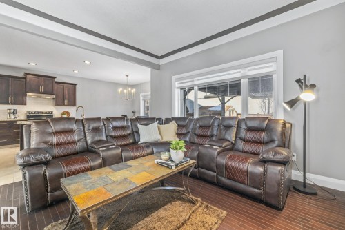 Living room featuring a chandelier and baseboards - 167 Bremner Crescent, Fort Saskatchewan, AB - Indoor Photo Showing Living Room
