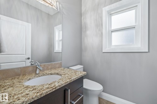 Half bath featuring vanity and toilet - 167 Bremner Crescent, Fort Saskatchewan, AB - Indoor Photo Showing Bathroom