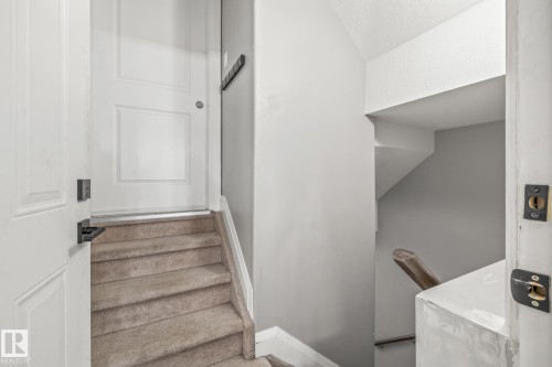 Stairway with baseboards - 167 Bremner Crescent, Fort Saskatchewan, AB - Indoor Photo Showing Other Room