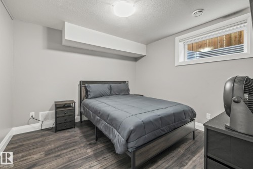 Bedroom featuring a textured ceiling and wood finished floors - 167 Bremner Crescent, Fort Saskatchewan, AB - Indoor Photo Showing Bedroom