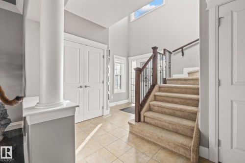 Foyer entrance featuring light tile patterned flooring and a high ceiling - 167 Bremner Crescent, Fort Saskatchewan, AB - Indoor Photo Showing Other Room