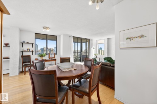 Dining area with light wood-style flooring and plenty of natural light - 1502 10160 115 Street, Edmonton, AB - Indoor Photo Showing Dining Room
