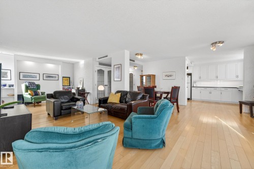 Living room featuring light wood-style flooring - 1502 10160 115 Street, Edmonton, AB - Indoor Photo Showing Living Room