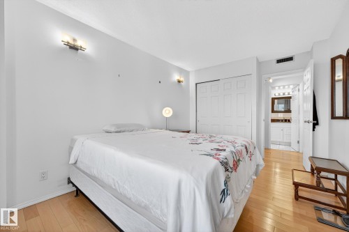 Bedroom featuring light wood-style floors and a closet - 1502 10160 115 Street, Edmonton, AB - Indoor Photo Showing Bedroom