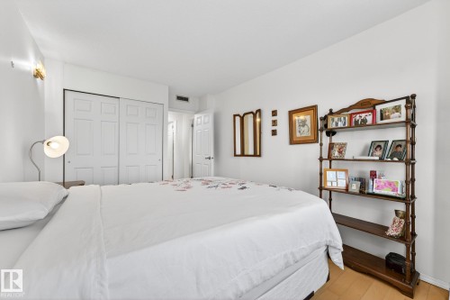 Bedroom featuring light wood finished floors and a closet - 1502 10160 115 Street, Edmonton, AB - Indoor Photo Showing Bedroom