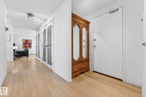 Foyer with light wood finished floors - 1502 10160 115 Street, Edmonton, AB - Indoor Photo Showing Other Room